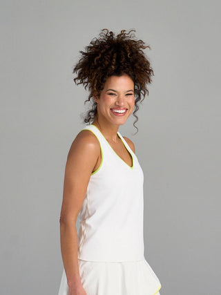 Model is wearing size small in The Jenni - White tank and The Sondra - White/Ace skort.