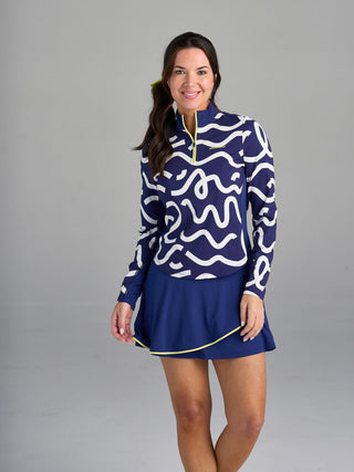 Model is wearing size small in  The Brooksie - Rally Print pullover and The Sondra - Midnight skort.