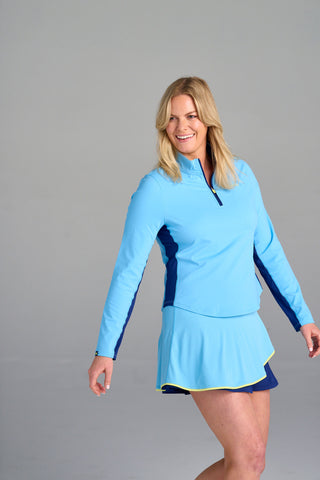 Model is wearing size large in The Brooksie - Sky Blue pullover and The Sondra - Two Tone skort.
