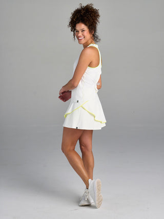 Model is wearing size small in The Jenni - White tank and The Sondra - White/Ace skort.